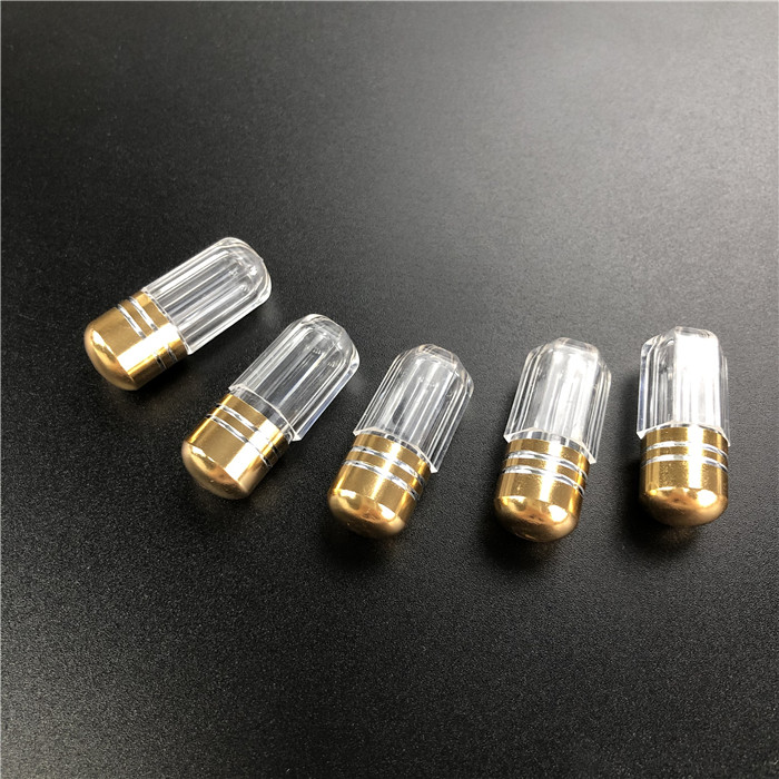 Plastikowy pojemnik z metalowym wyciągiem do tabletek męskich.